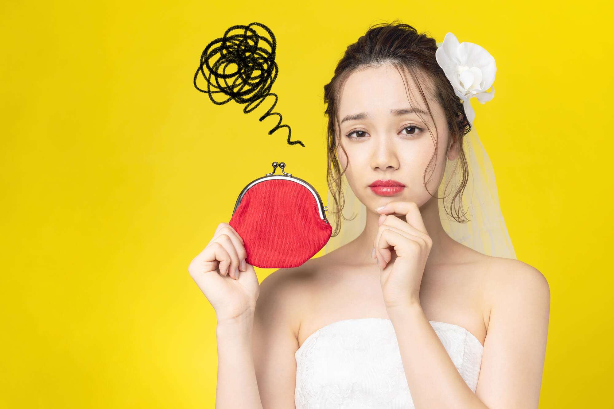 お金で悩むウェディングドレスを着た女性